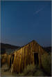 Cabin with a meteor trail